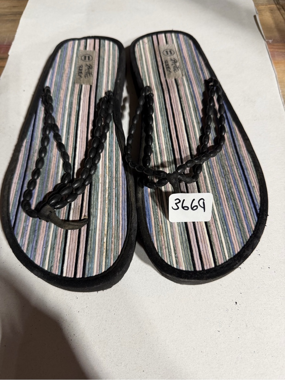#3669-Black Braided Strap Flip Flops with Pastel Striped Footbed